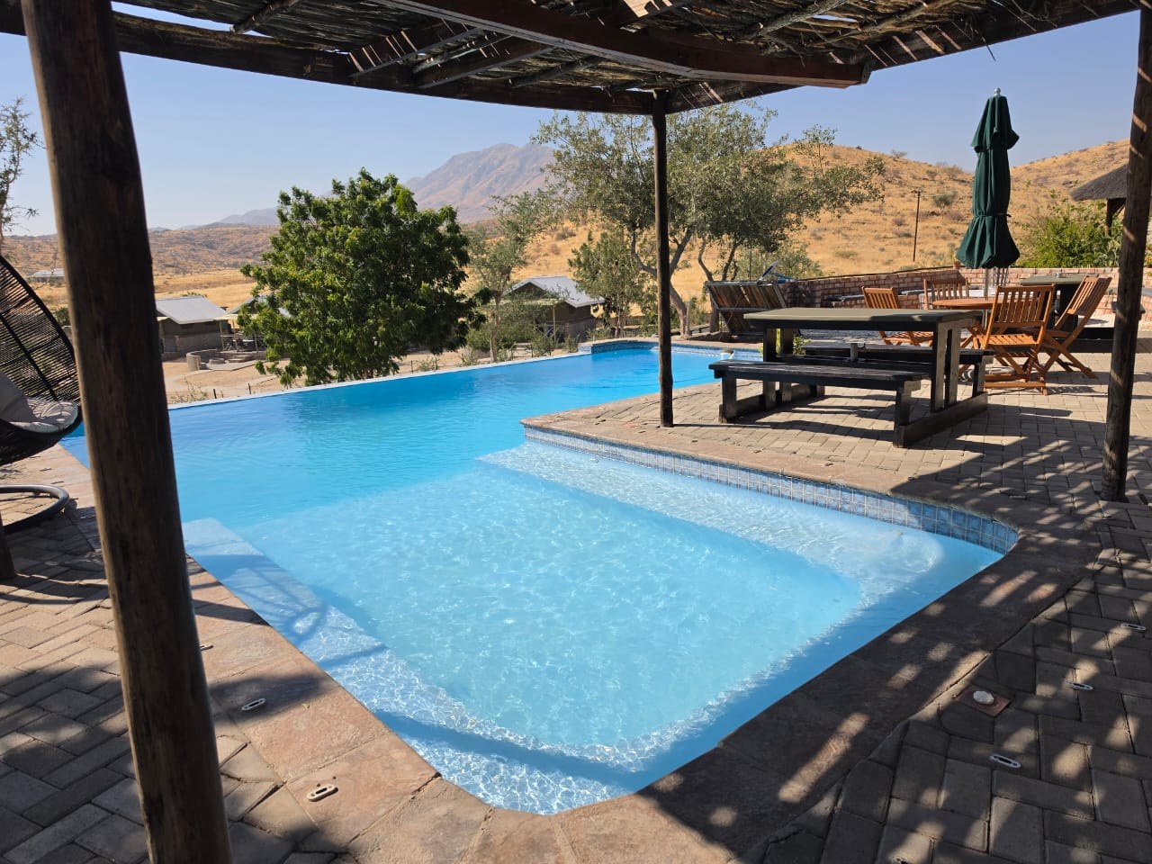 Lodge swimming pool and shaded terrace